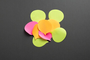 Overlapping speech bubbles symbol of information overload and excessive notifications on dark background