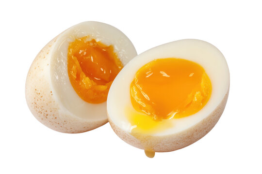 Soft boiled egg with bright orange yolk isolated on transparent background. Soft boiled egg sliced in half showing runny yolk isolated on white background.