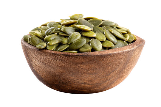 Bowl of raw pumpkin seeds isolated on transparent background. Shelled pumpkin seeds in wooden bowl isolated on white background.