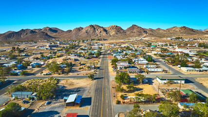 Aerial Beatty Nevada Small Town and Mountain Landscape Under Bright Blue Sky © Nicholas J. Klein