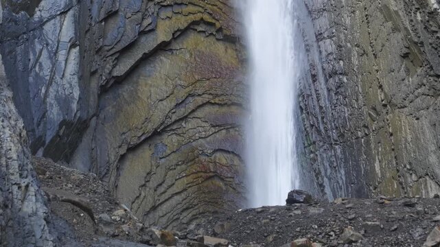powerful stream of the Zrykhskiy Vodopad (Zrykh waterfall) in the Akhtynsky District of the Eastern Caucasus mountains in Dagestan, Russia, captured with high clarity. The white, frothy water plunges 