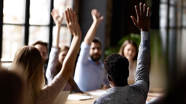 Diverse business team raising hands voting at meeting