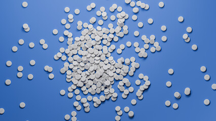 Weight loss pills available: A heap of GLP-1 pills on a blue background. Top down shot.
