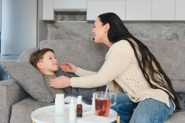 Mother caring for sick son at home