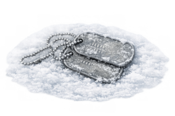 Military dog tags resting on snow remembering sacrifice