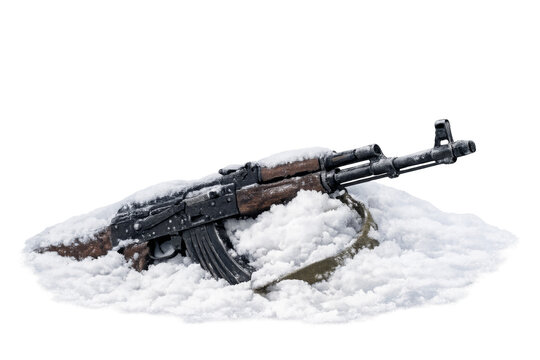 Assault rifle laying in snow with transparent background