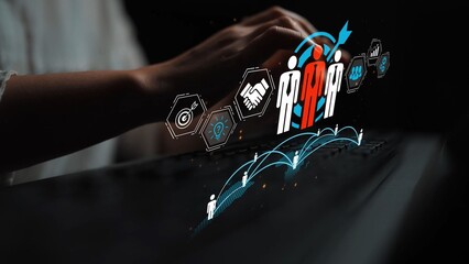 Hand typing on keyboard with digital icons representing teamwork, connection, strategy, and communication in a dark environment to emphasize modern collaboration concepts Gluon.