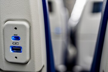 The USB ports inside of the passenger cabin of an airplane