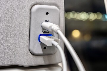 The USB ports inside of the passenger cabin of an airplane