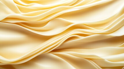 Fototapeta premium An elegant satin fabric drapes gracefully with subtle waves and folds, exuding a sense of luxury and sophistication, ideal for fashion and textile visuals.