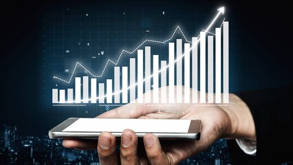 A hand holding a smartphone displays a business growth graph, symbolizing data analysis and financial strategy. Ideal for projects focused on finance and technology. Copula