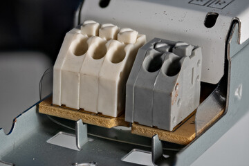 A macro detail of a terminal block from a fluorescent lamp ballast.

