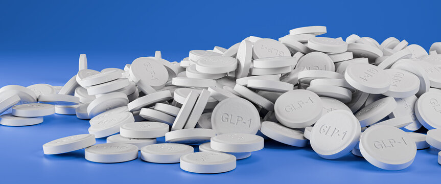 Weight loss pills available: A heap of GLP-1 pills on a blue background.