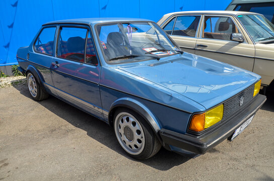 Retro light blue Volkswagen Jetta (A1 generation) two-door sedan, vintage German compact car represents classic 1980s styling and tuner culture