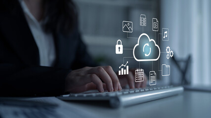 A business professional works on a laptop, surrounded by various digital icons representing cloud technology and data management solutions in a modern workspace. Gantry