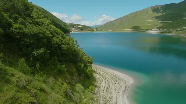 Experience the natural beauty of Kazenoyam Lake, the largest high-altitude lake in the North Caucasus, located on the border of the Chechen Republic and Dagestan, Russia. This cinematic drone footage 