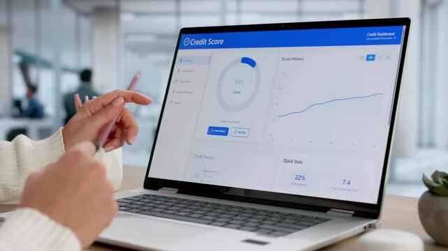 Woman Looking At With Good Credit Score Report