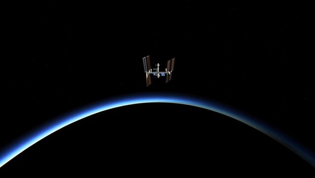 A space station hovers in low Earth orbit. The planet's curvature forms a blue line beneath the station, representing Earth's atmosphere. This view captures the vastness of space.
