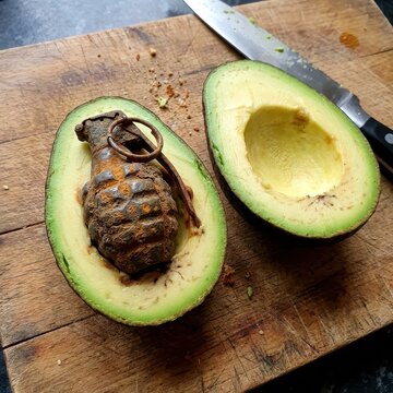 Dangerous Fruit: A Rusty Hand Grenade Resting Inside a Sliced Avocado on a Weathered Wooden Board