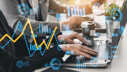 A focused business environment showcasing a team analyzing financial data on a laptop, illustrated with dynamic graphs and digital statistics, representing productivity. Xenic