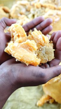 Hands holding Fresh Jaggery, Food Video 