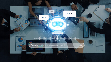 A business team utilizes an artificial intelligence chatbot during a meeting to enhance scheduling and data analysis, showcasing modern technological solutions in the workplace. Trope
