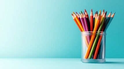 A vibrant collection of colored pencils arranged in a glass jar, reflecting creativity and artistic potential, perfect for showcasing the joy of artistic expression.
