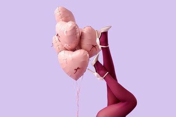 Female legs in high heels with heart-shaped balloons on purple background. Valentine's Day...