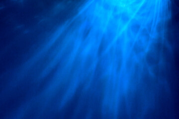 Paper abstraction. Highlights and shadows on blue cardboard