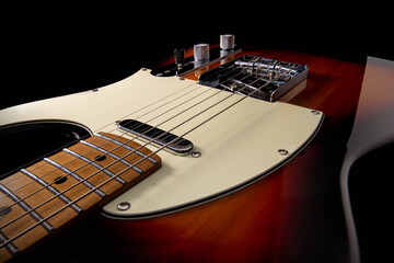 Fototapeta premium Perspective view from the neck of an elegant guitar featuring a detailed chrome pickup, with a beautiful reflection that contours and defines the guitar's body.