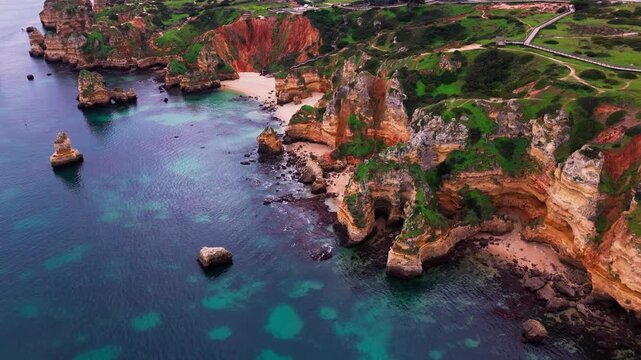Aerial view of Praia do Camilo Beach and Cliffs in Lagos, Algarve, Portugal