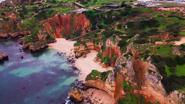 Aerial view of Praia do Camilo Beach and Cliffs in Lagos, Algarve, Portugal