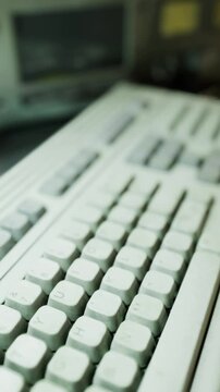 Detailed photograph highlighting both old and new keyboard styles, Close view of computer keyboard presenting mix of retro and contemporary features