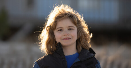 Closeup kids portrait. Dreamy teen child. Daydreaming kid. Close-up view of blond Boy. Close up...