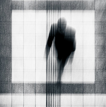 silhouette of a man rushing in the city