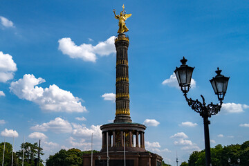Naklejka premium Victory Column in Berlin. Golden statue Victory Column above Berlin. Tourists visit iconic Victory Column. Architectural details in Berlin.