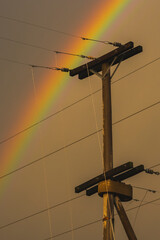 Electric line in the storm rainbow landscape, La Pampa Province, Patagonia , Argentina.