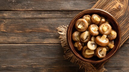 Canned champignon mushrooms on a rustic table gourmet dish with fresh ingredients top view with space for text