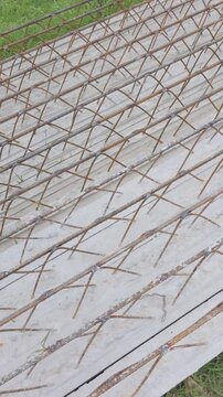 Geometric patterns of steel in modern construction, corrugated steel bars in prefabricated joists on the ground