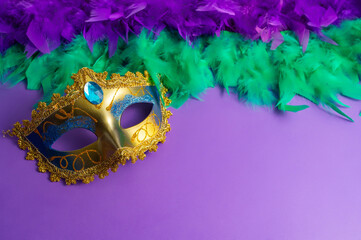 Vibrant Mardi Gras background with mask, beads, and festive decorations