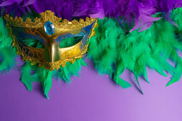 Vibrant Mardi Gras background with mask, beads, and festive decorations