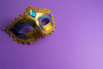 Vibrant Mardi Gras background with mask, beads, and festive decorations