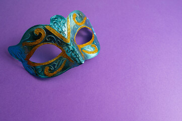 Vibrant Mardi Gras background with mask, beads, and festive decorations