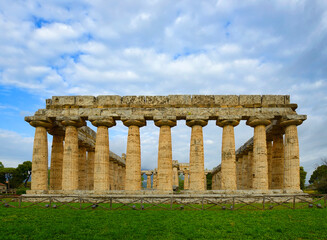 Fototapeta premium Temple of Hera in Paestum, Greek temple of Magna Graecia, the ruins of the ancient city of Paestum. UNESCO World Heritage Site, municipality of Capaccio, province of Salerno, Italy