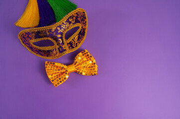 Vibrant Mardi Gras background with mask, beads, and festive decorations