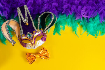Vibrant Mardi Gras background with mask, beads, and festive decorations