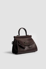 Naklejka premium Women's handbag on a white background.
