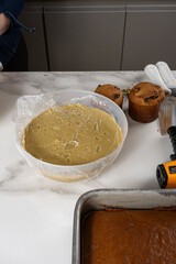 A bowl of pistachio cream on the marble table_vertical.