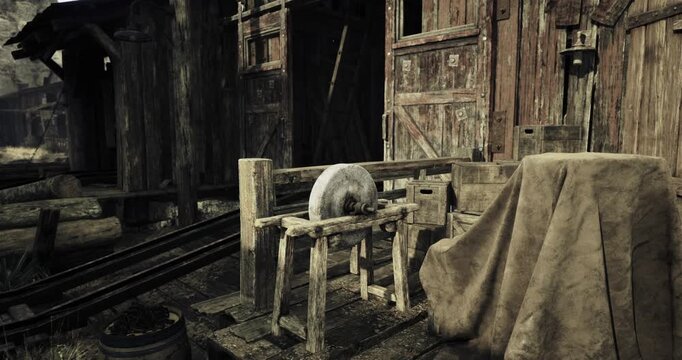 A weathered grinding stone rests on a wooden stand outside an aging workshop surrounded by rustic structures. The scene captures the charm of a bygone era, with hints of nature in the background.