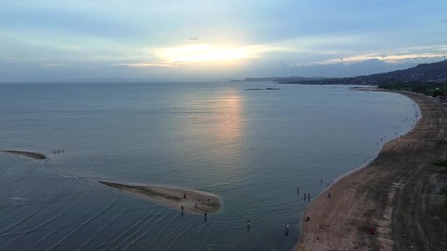 A beautiful ocean view with a sunset in the background